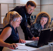 A certified Chief Architect personal trainer assisting two students