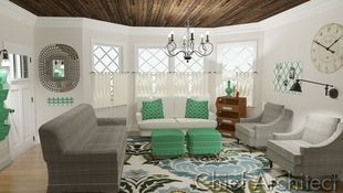White living room with bay window is furnished with country chic inspired pieces featuring teal, grey, and blue hues.